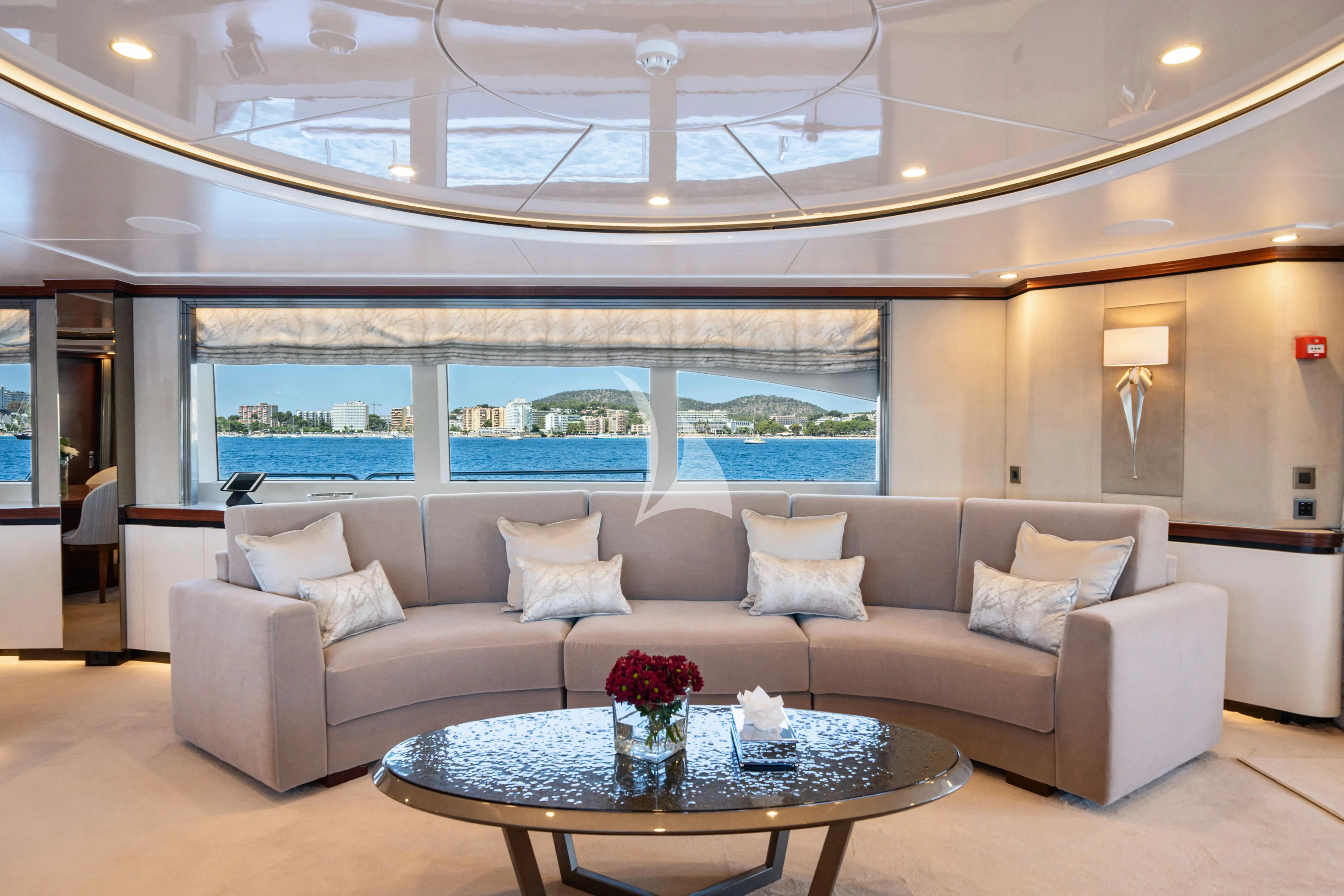 a living room with a large window aboard TITIAN PEARL Yacht for Sale
