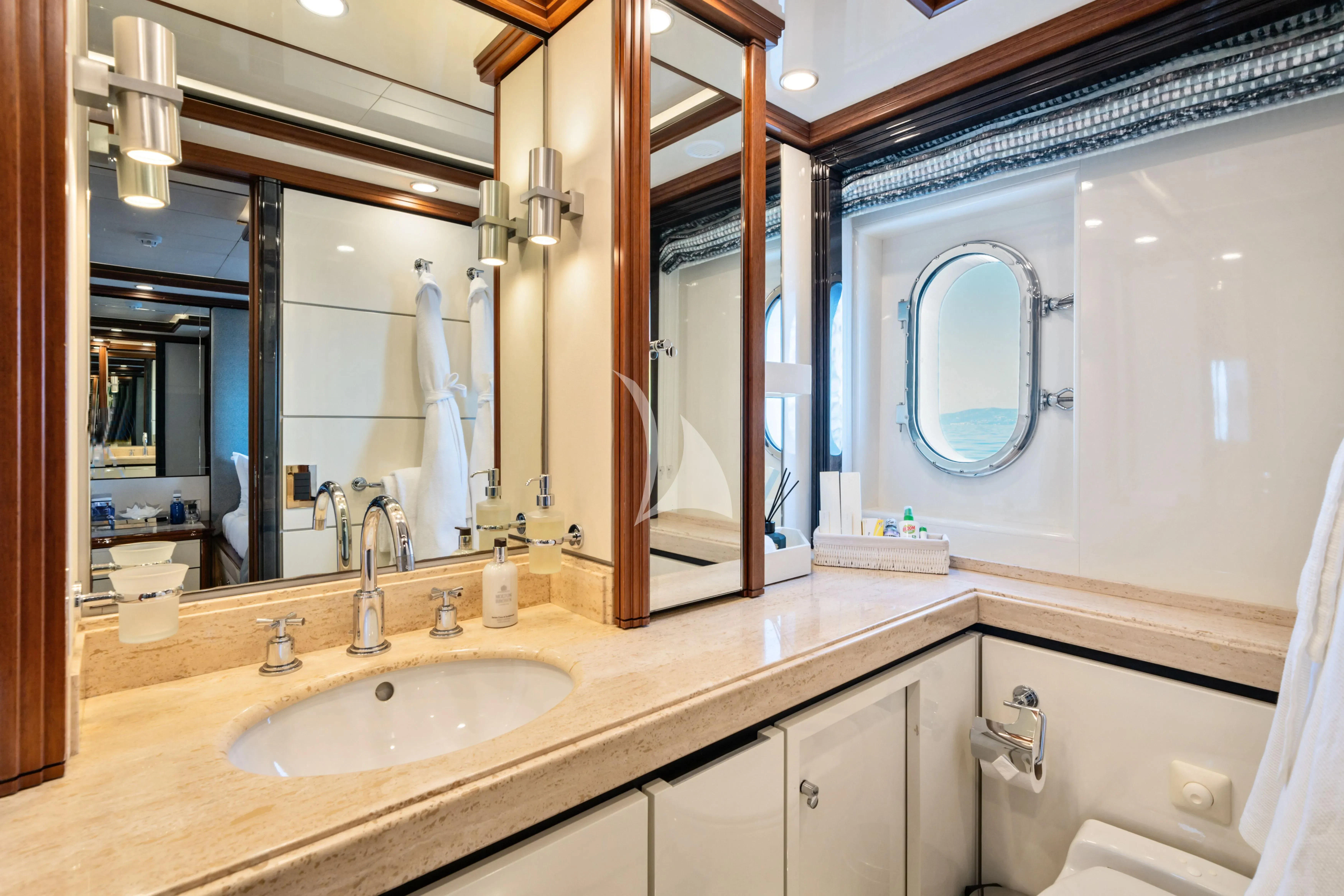 a bathroom with a large mirror aboard TITIAN PEARL Yacht for Sale