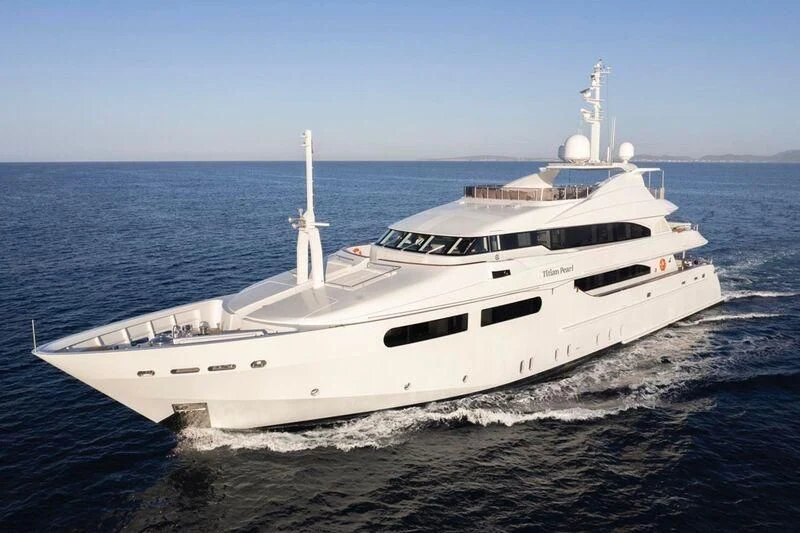 a white yacht on the water aboard TITIAN PEARL Yacht for Sale