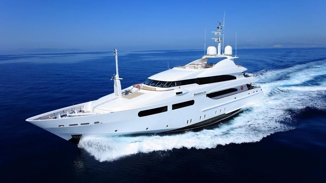 a white yacht on the water aboard TITIAN PEARL Yacht for Sale