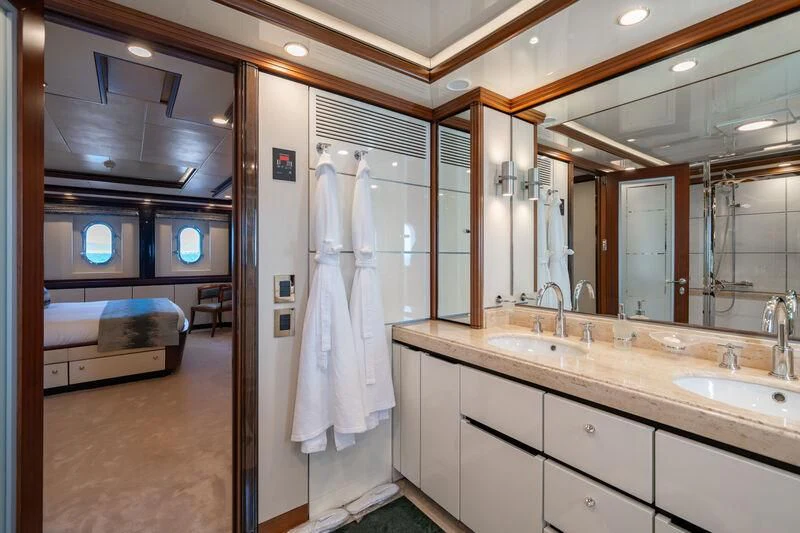 a bathroom with a large mirror aboard TITIAN PEARL Yacht for Sale