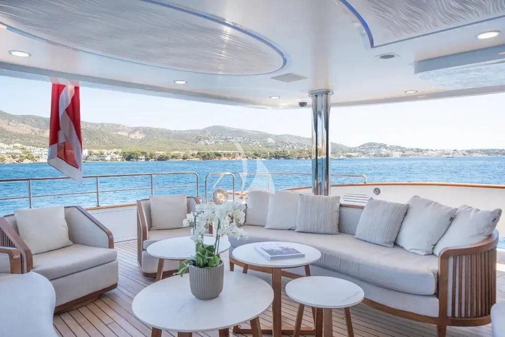 a living room with a large body of water and a large blue sky aboard TITIAN PEARL Yacht for Sale