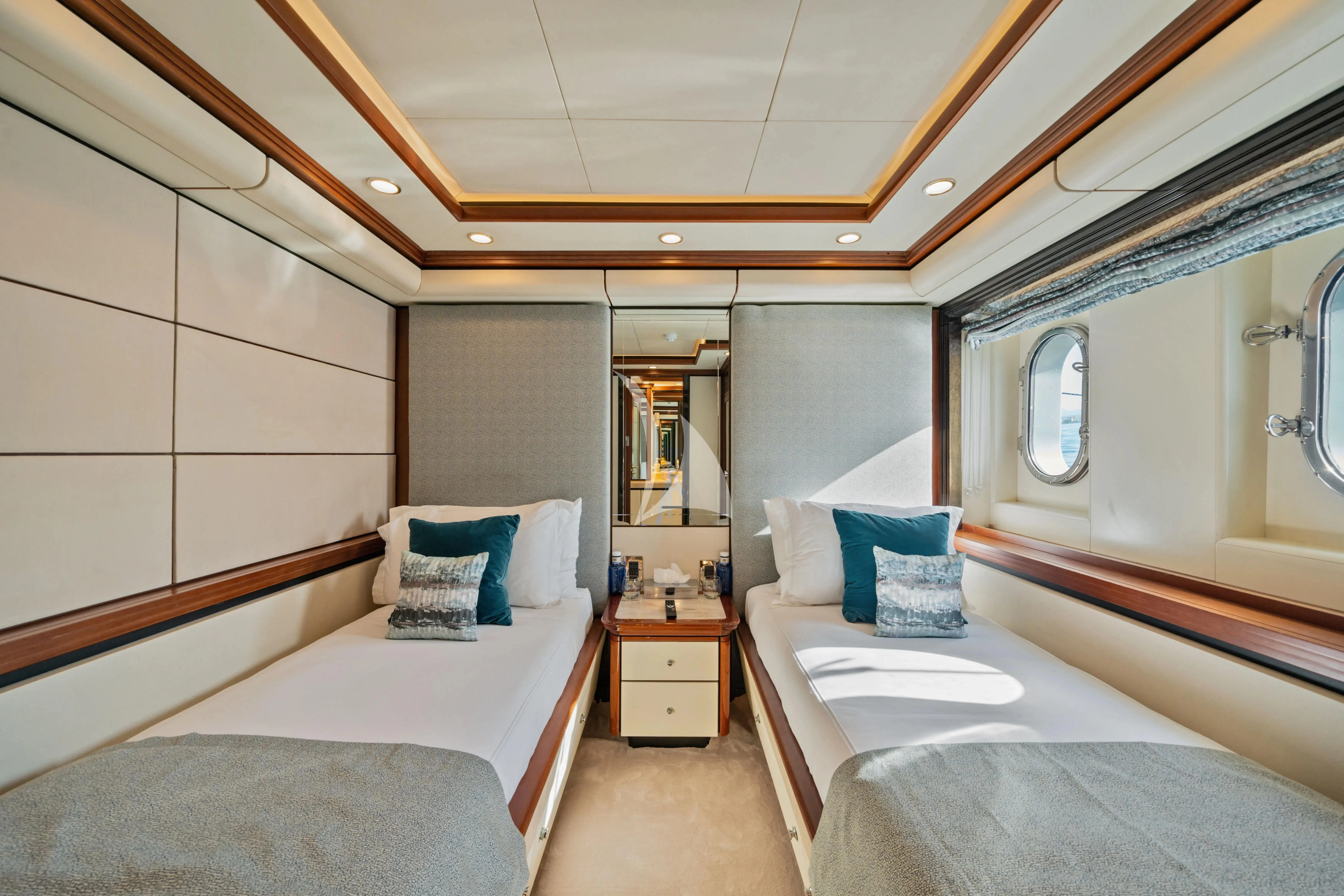 a room with two beds aboard TITIAN PEARL Yacht for Sale