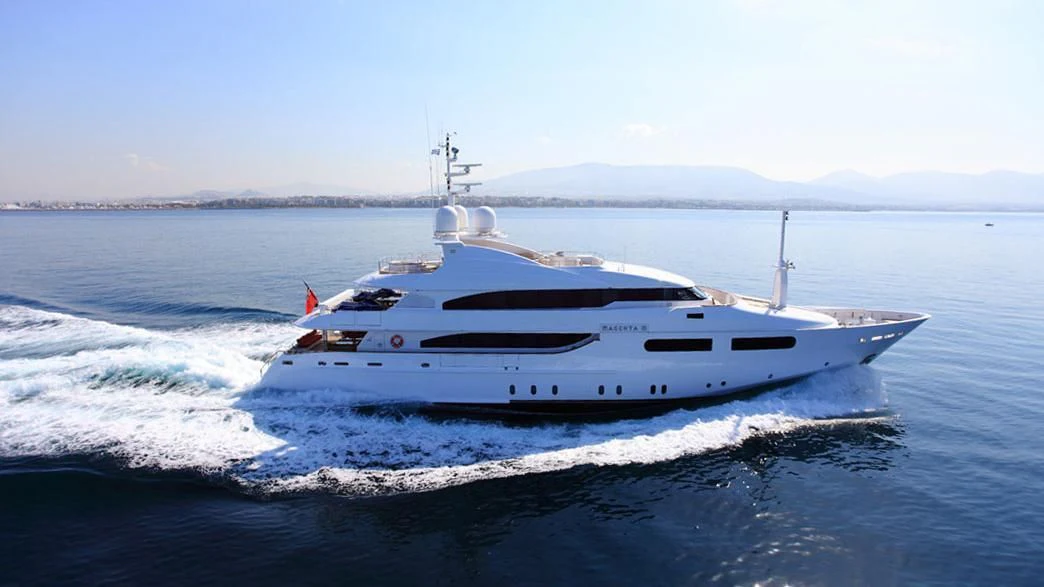 a white yacht on the water aboard TITIAN PEARL Yacht for Sale