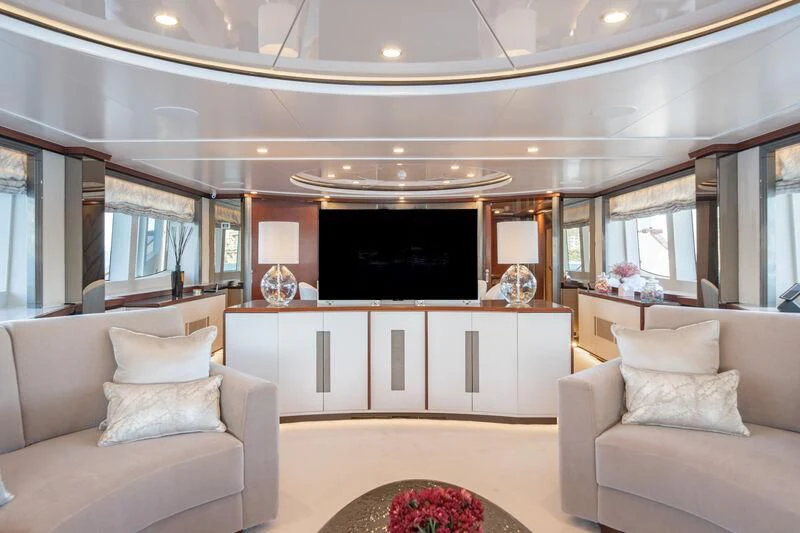 a living room with a fireplace aboard TITIAN PEARL Yacht for Sale