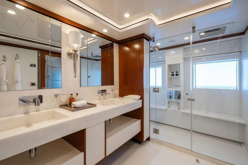 a bathroom with sinks and mirrors aboard TITIAN PEARL Yacht for Sale