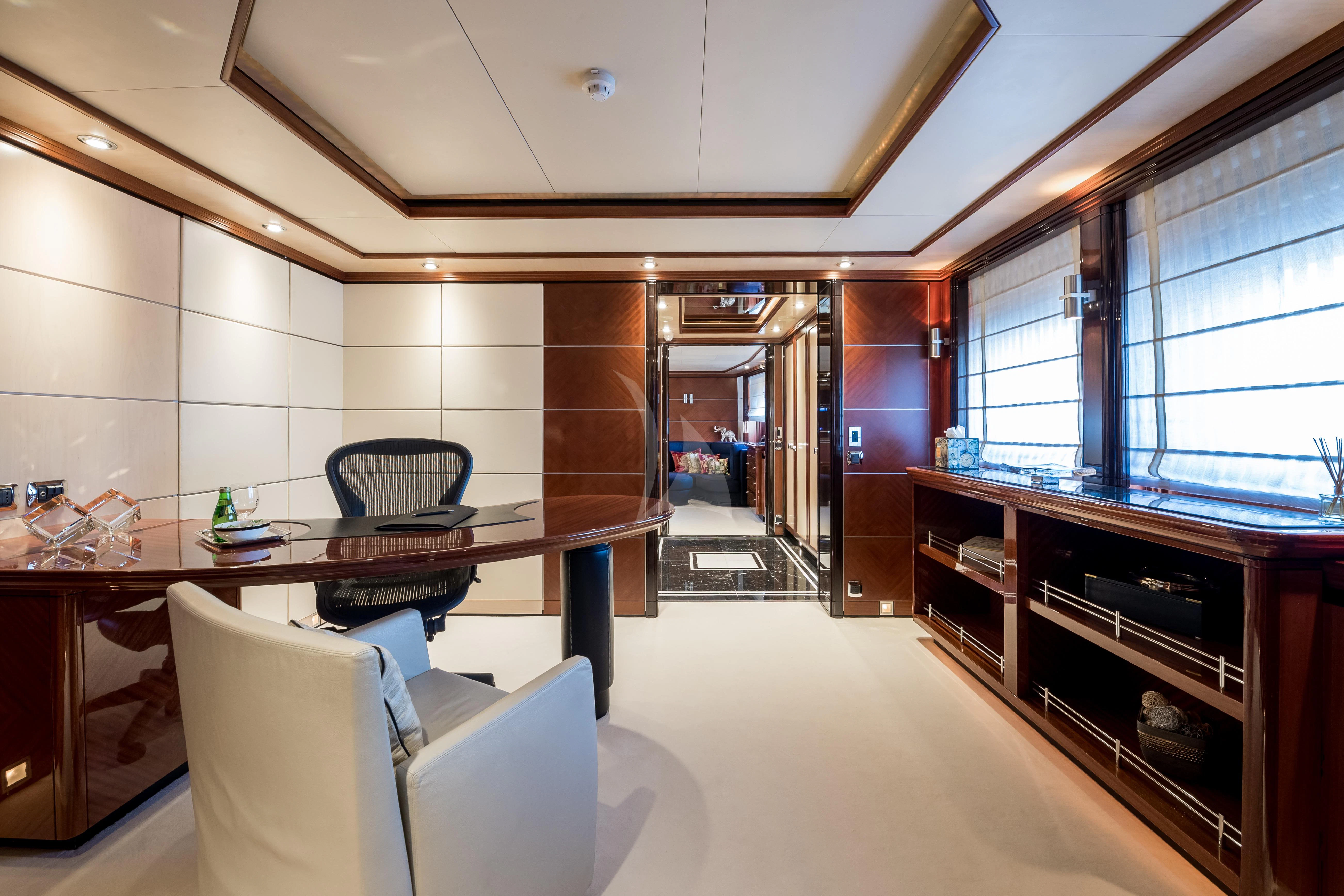 a room with a table and chairs aboard TITIAN PEARL Yacht for Sale