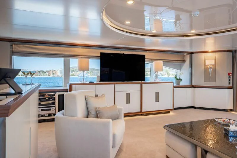 a living room with a large tv aboard TITIAN PEARL Yacht for Sale