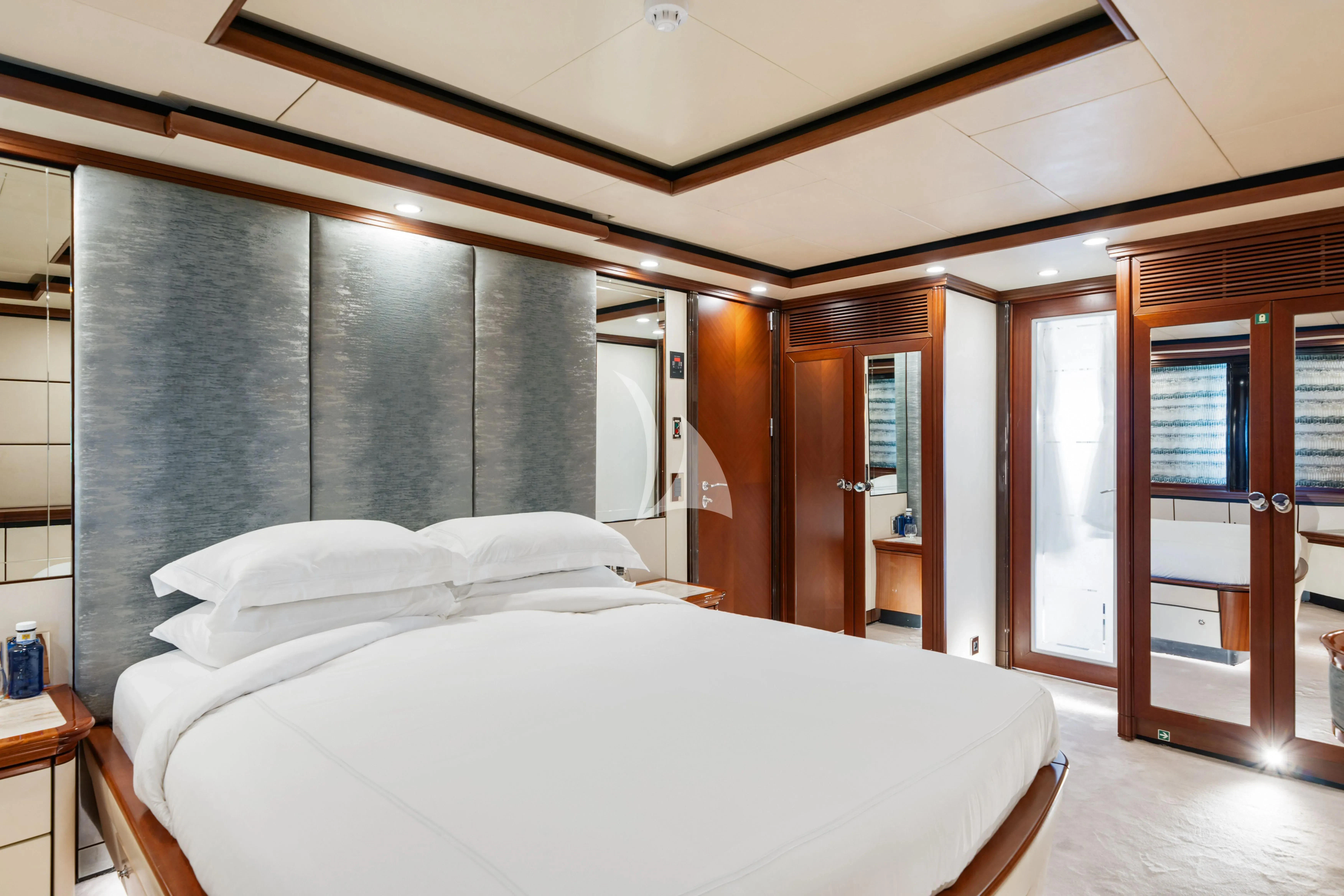 a bed in a room aboard TITIAN PEARL Yacht for Sale