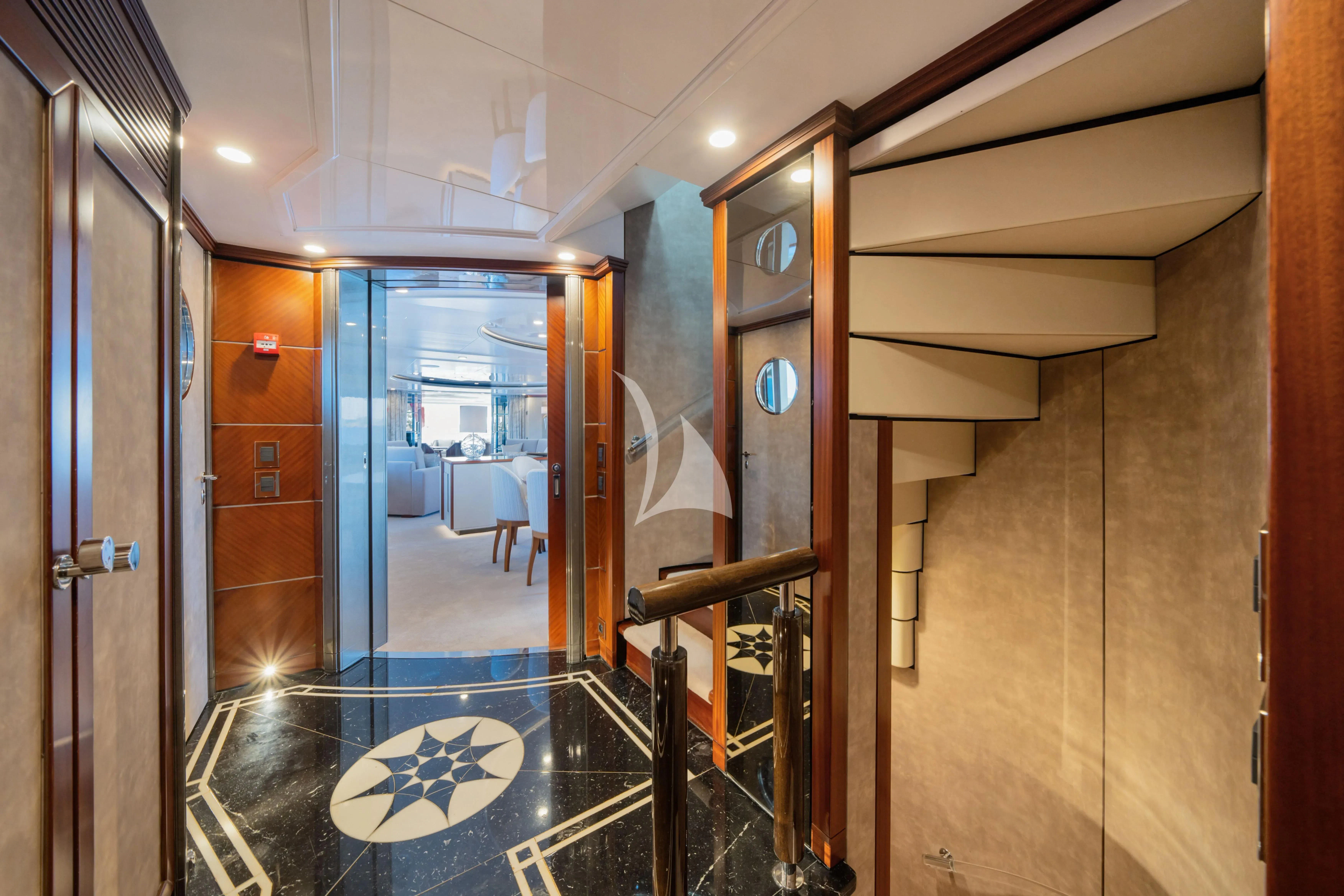 a hallway with a glass door aboard TITIAN PEARL Yacht for Sale