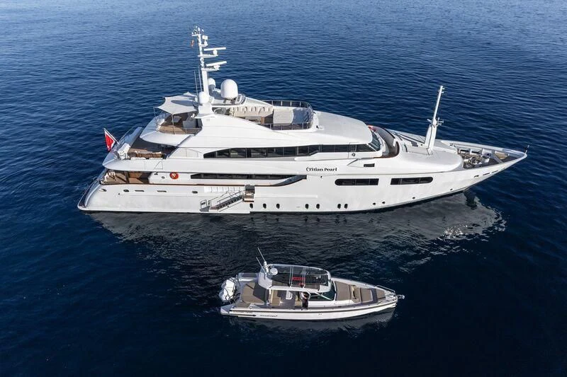 a large white ship in the water aboard TITIAN PEARL Yacht for Sale