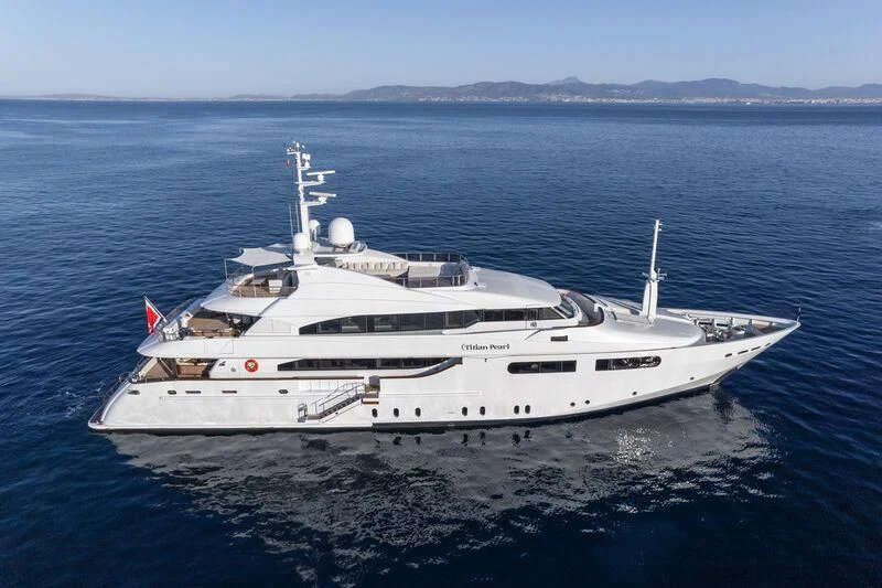 a large white yacht in the water aboard TITIAN PEARL Yacht for Sale