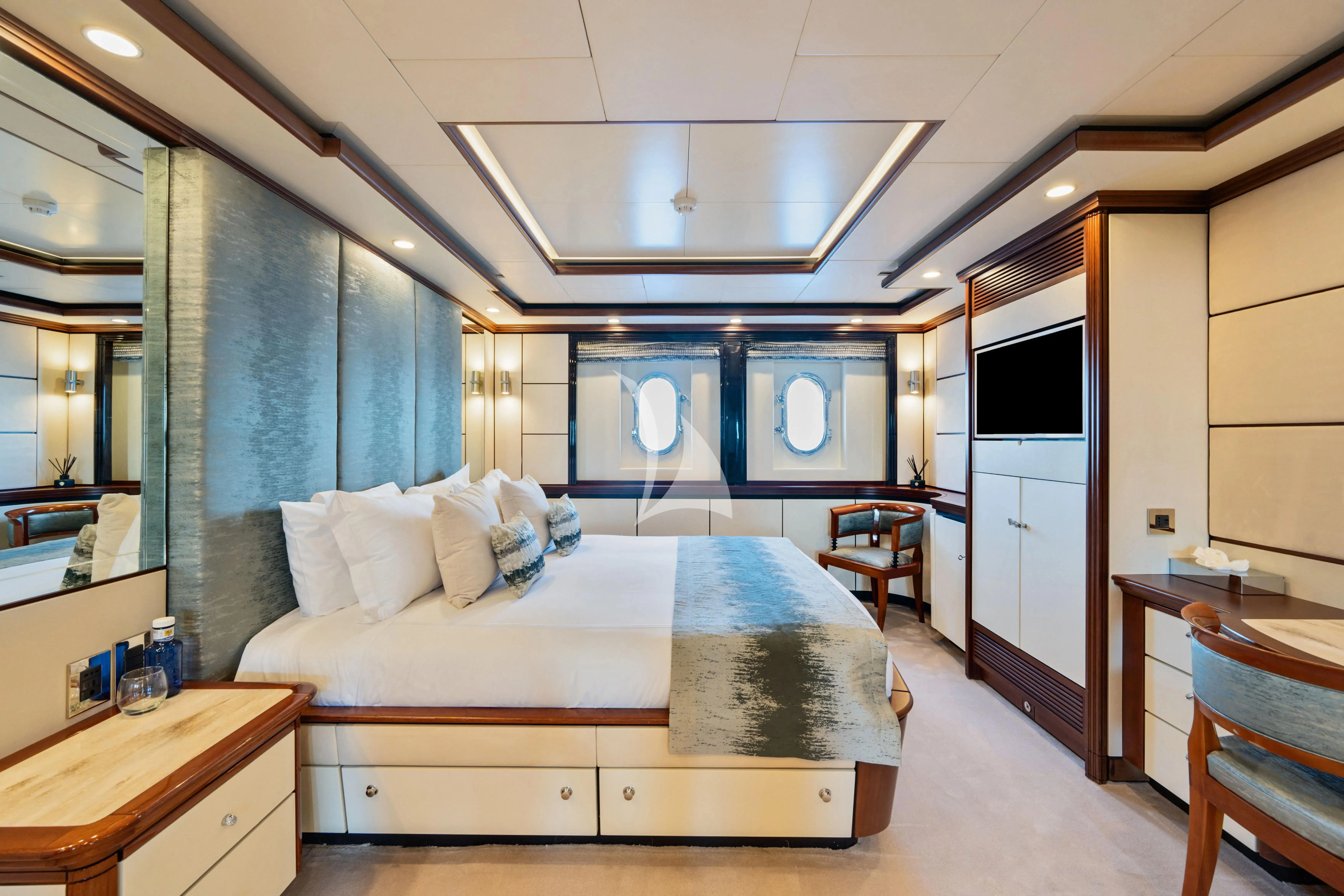 a bed in a room aboard TITIAN PEARL Yacht for Sale