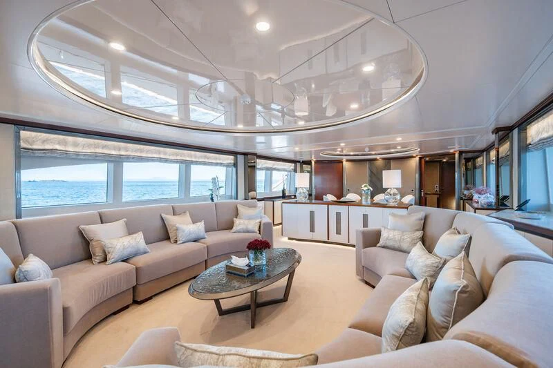 a living room with a large window aboard TITIAN PEARL Yacht for Sale