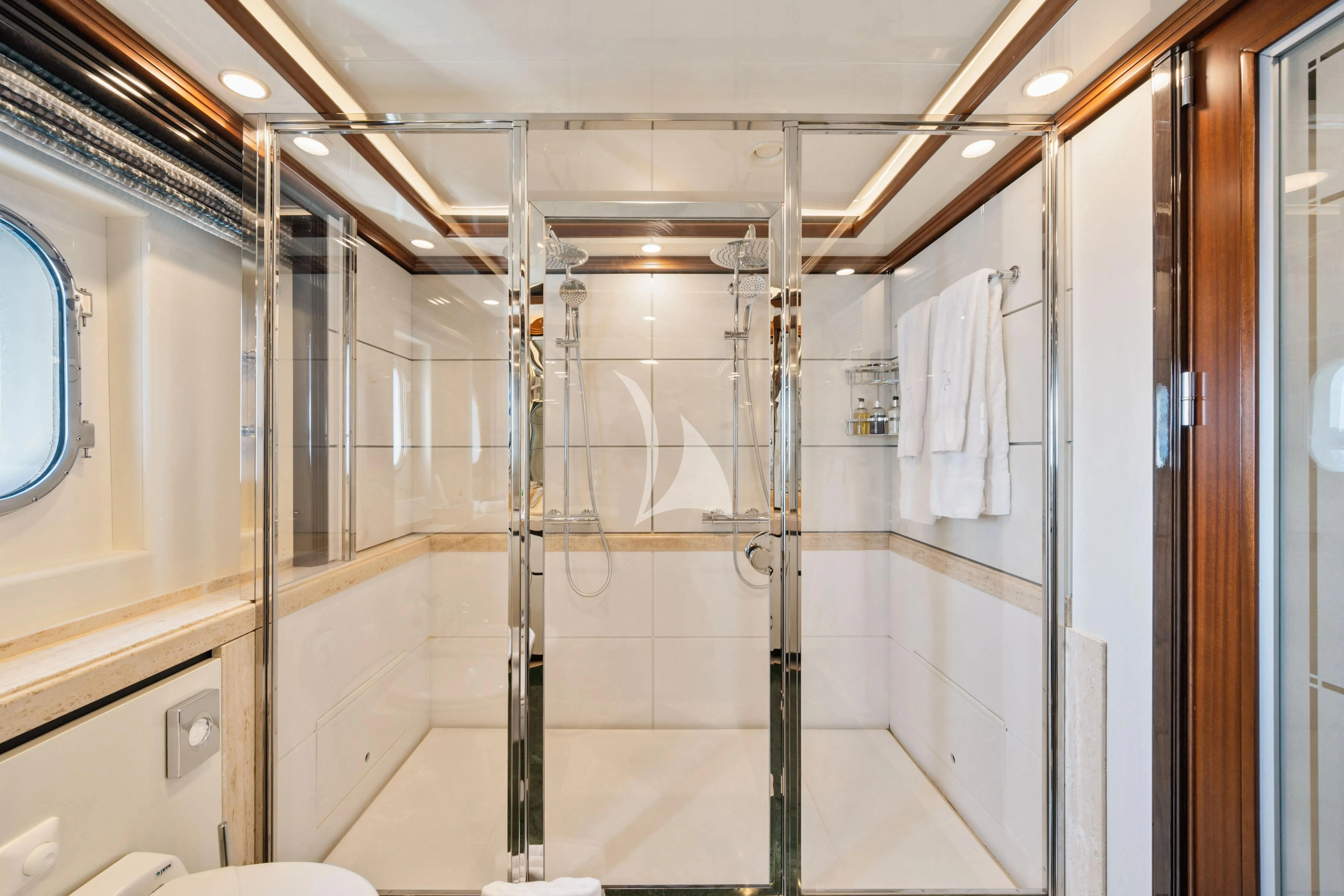 a bathroom with a glass shower aboard TITIAN PEARL Yacht for Sale
