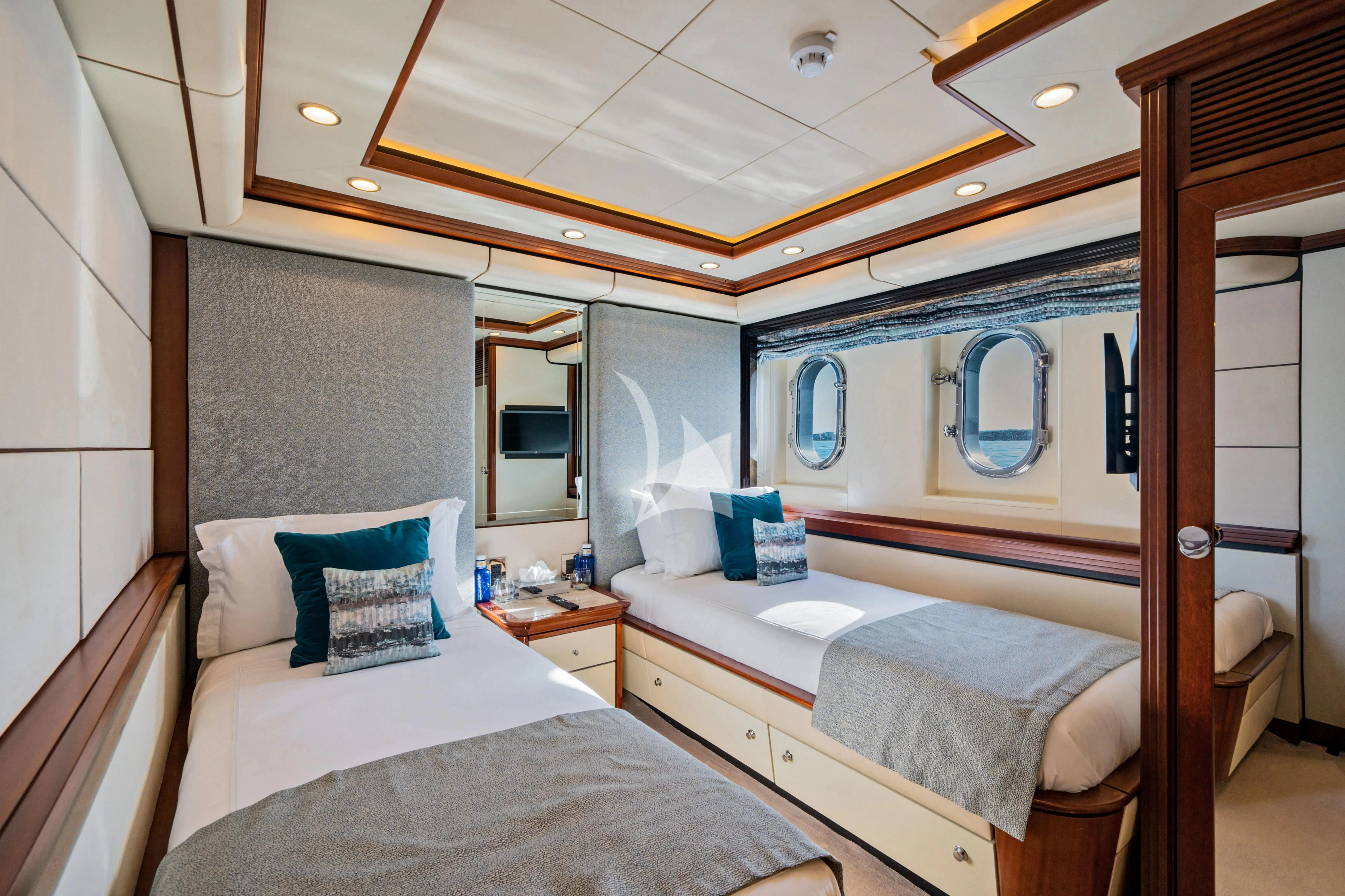 a couple of beds in a hotel room aboard TITIAN PEARL Yacht for Sale