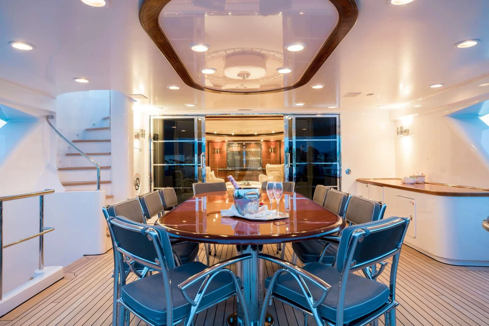 a dining room with a table and chairs aboard TITIAN PEARL Yacht for Sale