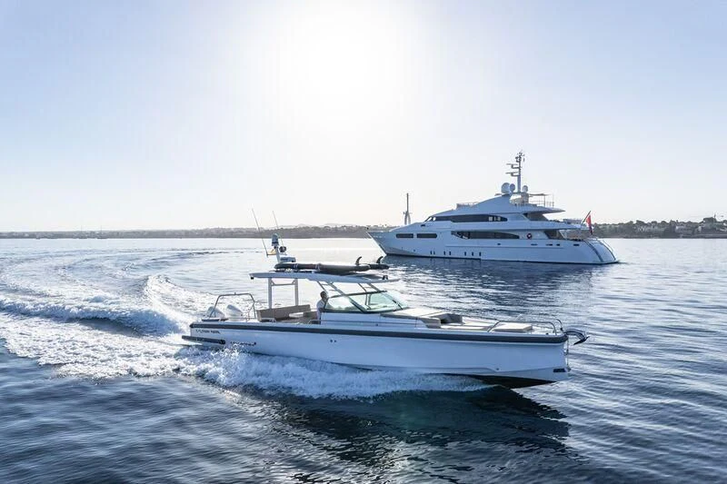 a couple of boats on the water aboard TITIAN PEARL Yacht for Sale