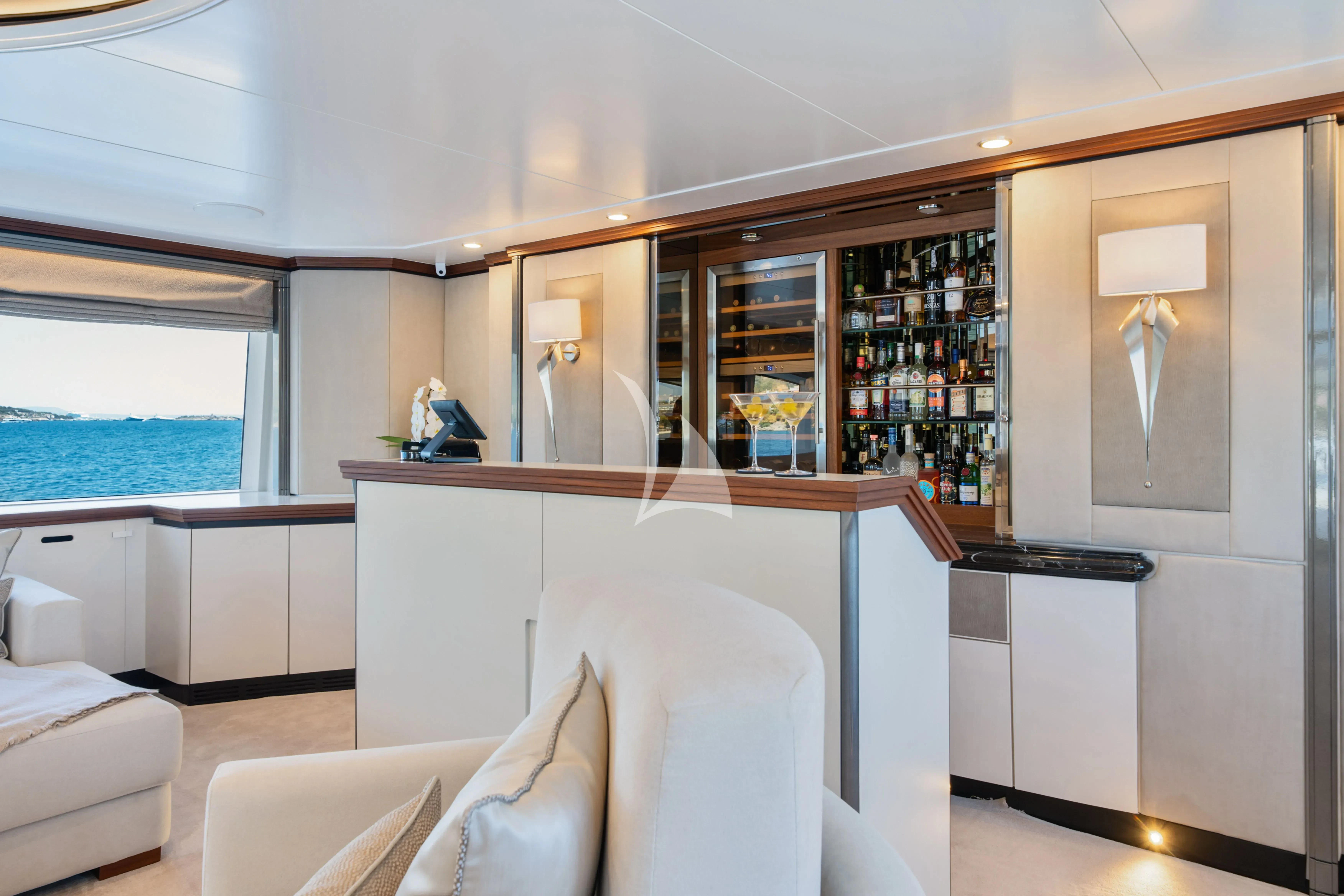 a room with a desk and a window aboard TITIAN PEARL Yacht for Sale