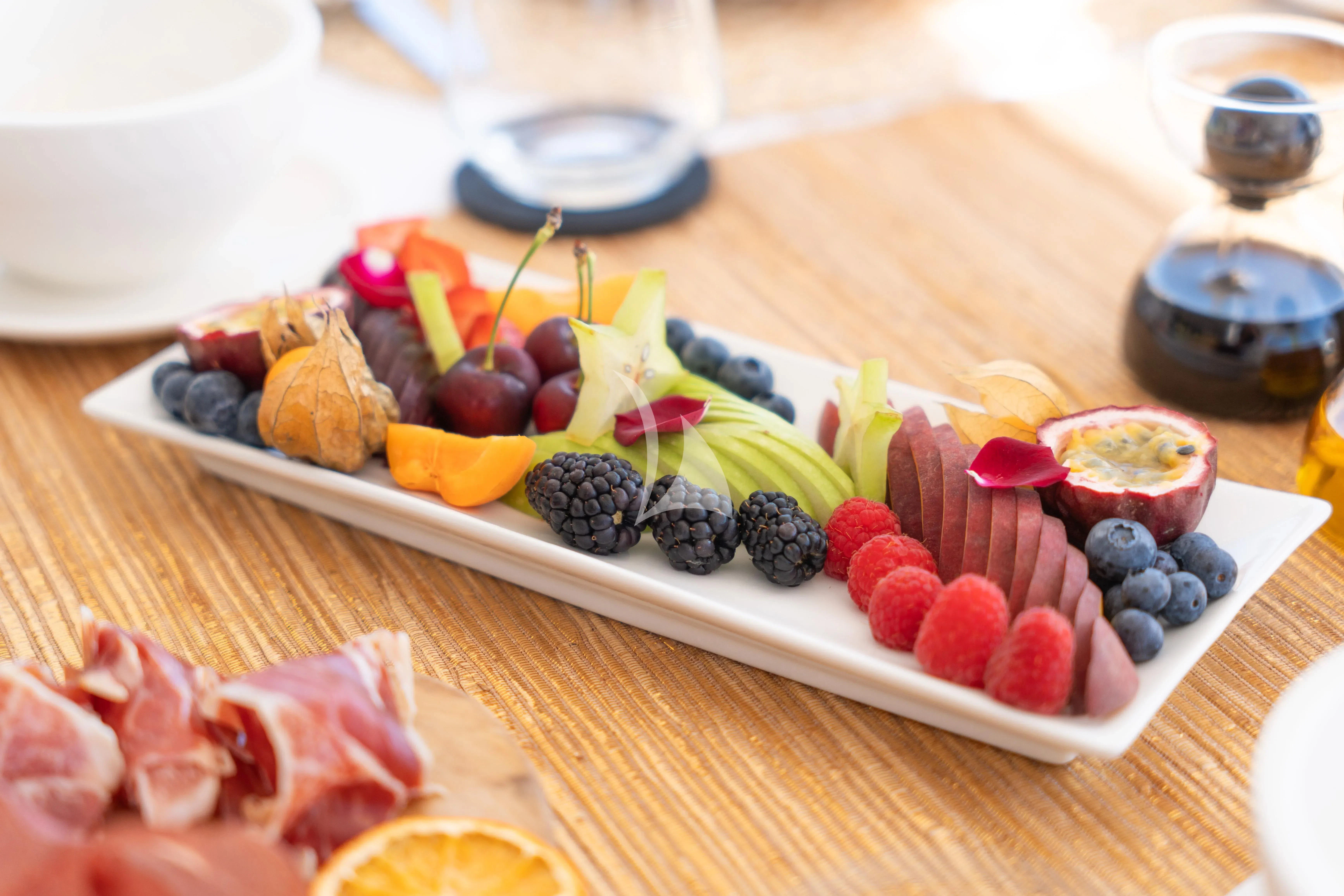 a platter of food aboard TITIAN PEARL Yacht for Sale