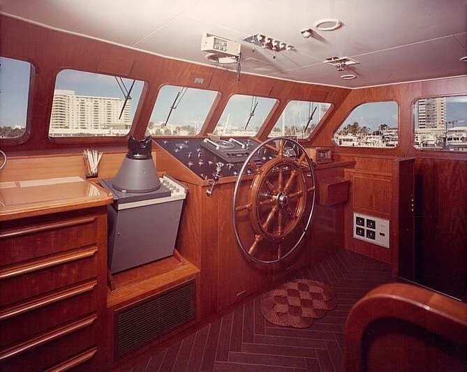 a room with a large clock and a large mirror aboard BLACKHAWK Yacht for Sale