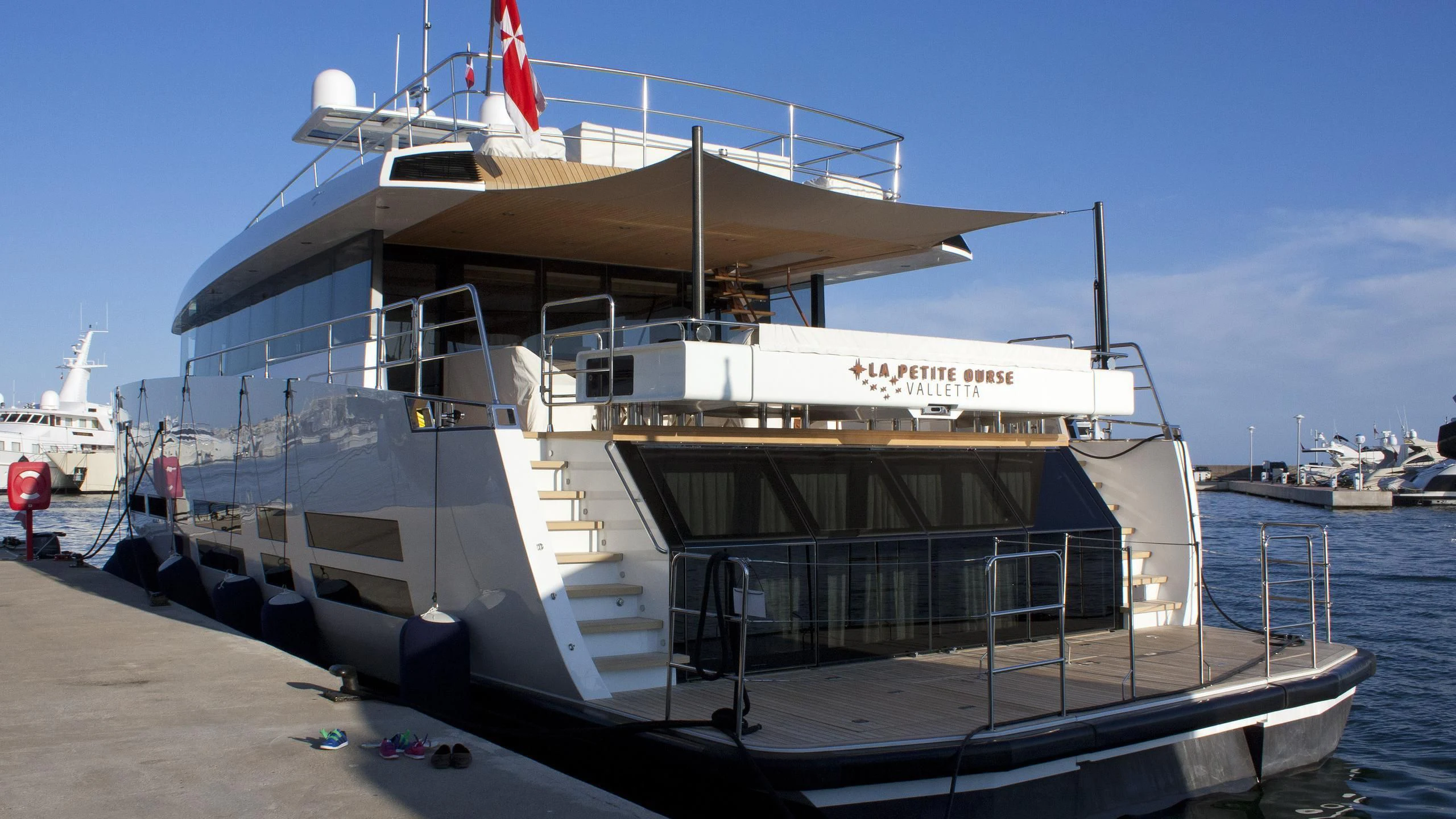 a boat docked at a pier aboard LA PETITE OURSE Yacht for Sale