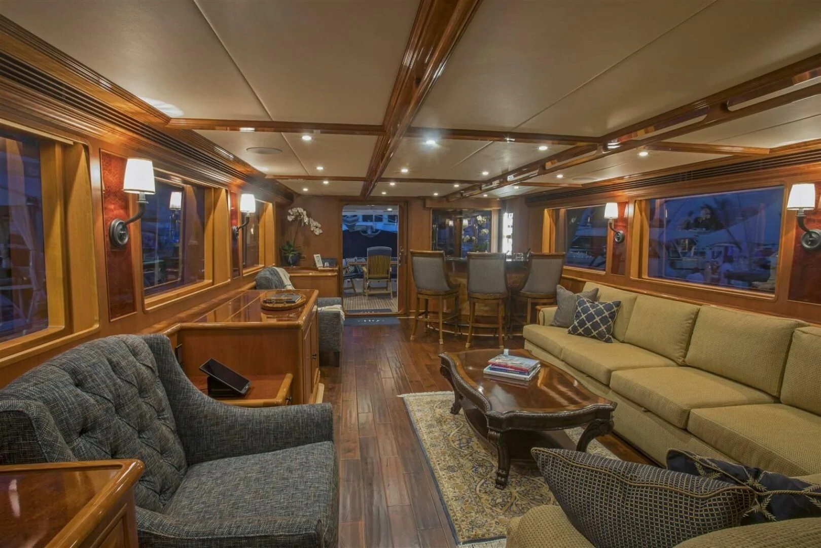 a living room with a couch and a coffee table aboard INSIGNIA Yacht for Sale
