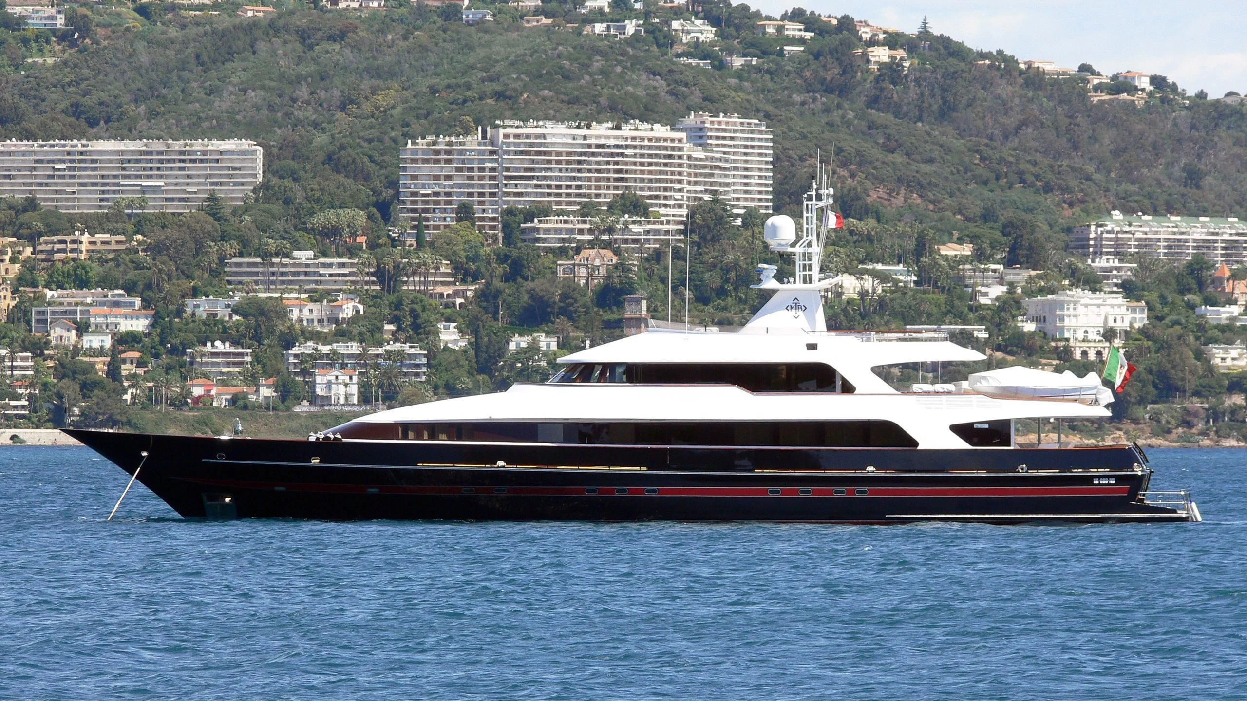 a large boat on the water aboard T.M. BLUE ONE Yacht for Sale