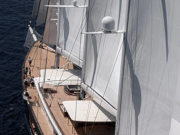 a large white boat with a large white sail aboard KORU Yacht for Sale