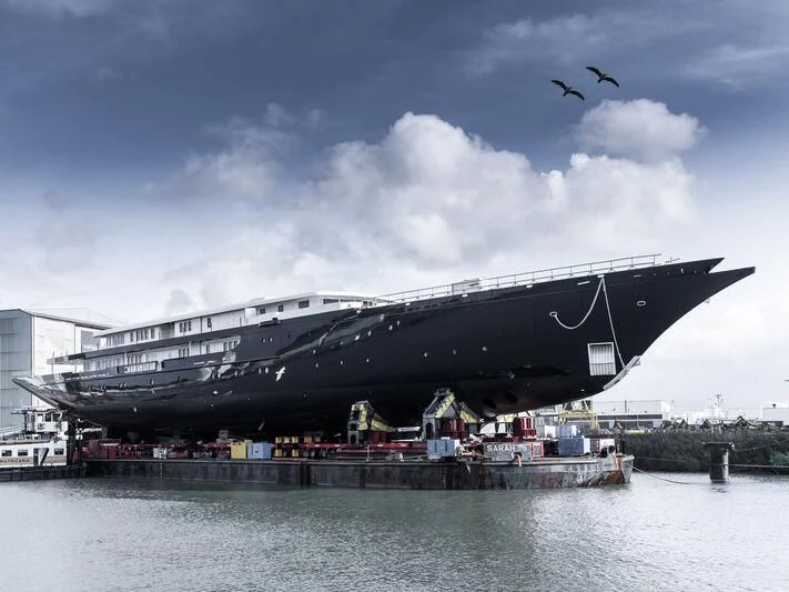 a large building with a large glass roof and a body of water aboard KORU Yacht for Sale