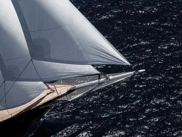 a space shuttle flying over a planet aboard KORU Yacht for Sale