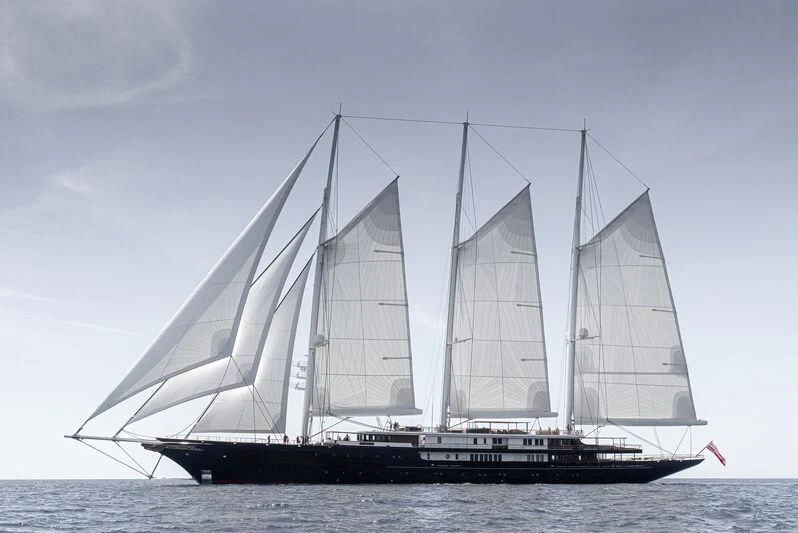a large sailboat on the water aboard KORU Yacht for Sale