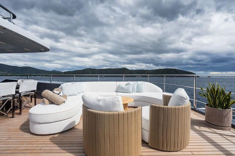 tables and chairs on a deck aboard PARA BELLVM Yacht for Charter