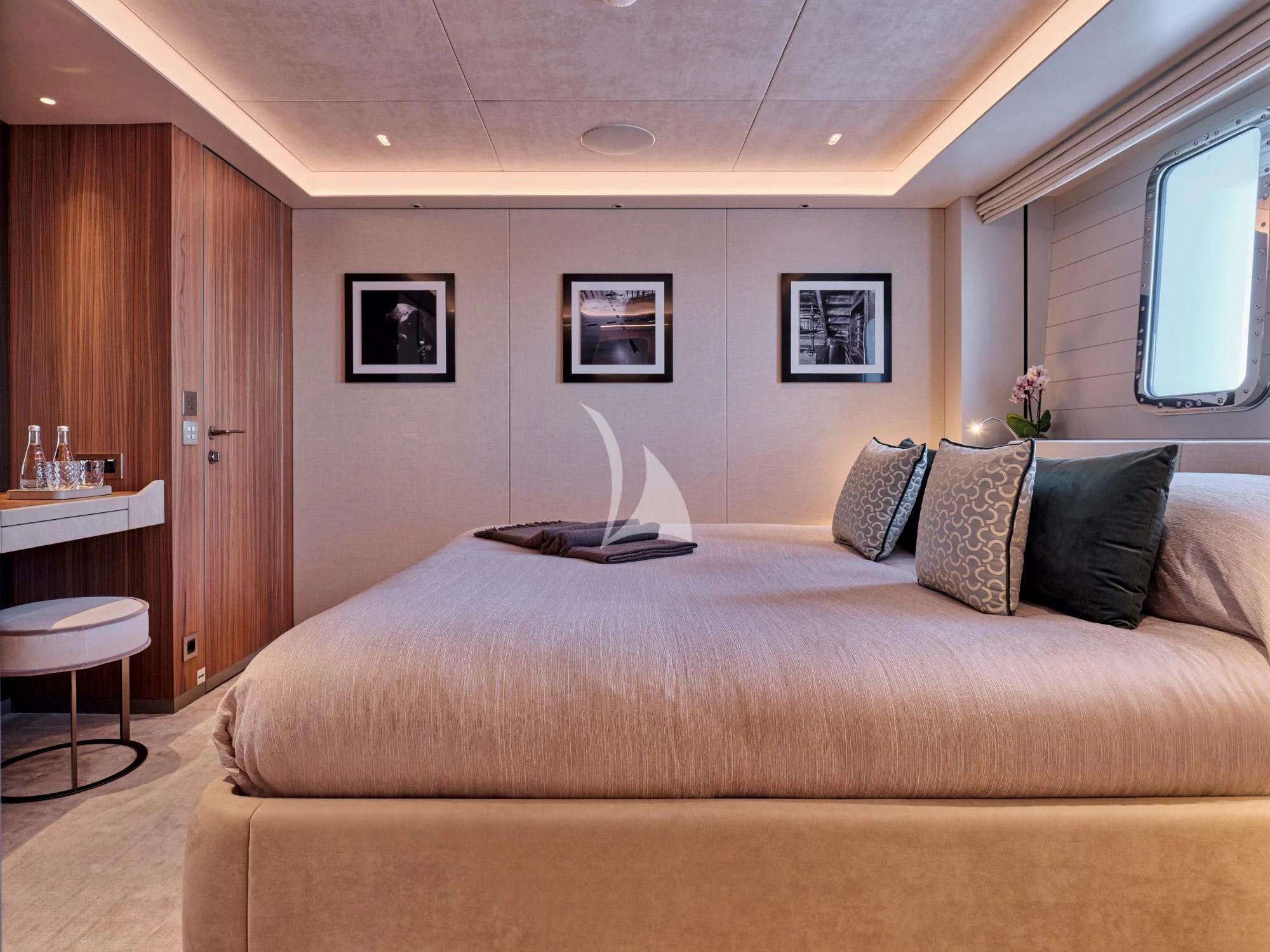 a bed with pillows on it aboard PARA BELLVM Yacht for Charter