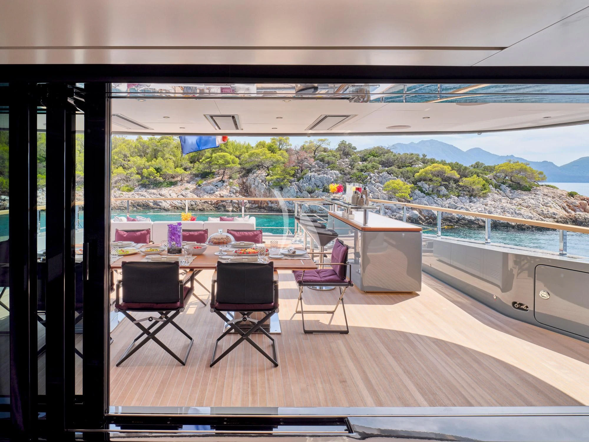 a room with a table and chairs aboard PARA BELLVM Yacht for Charter