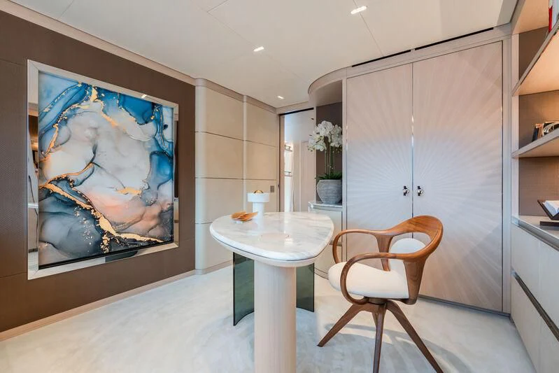 a room with a table and chairs aboard PARA BELLVM Yacht for Charter