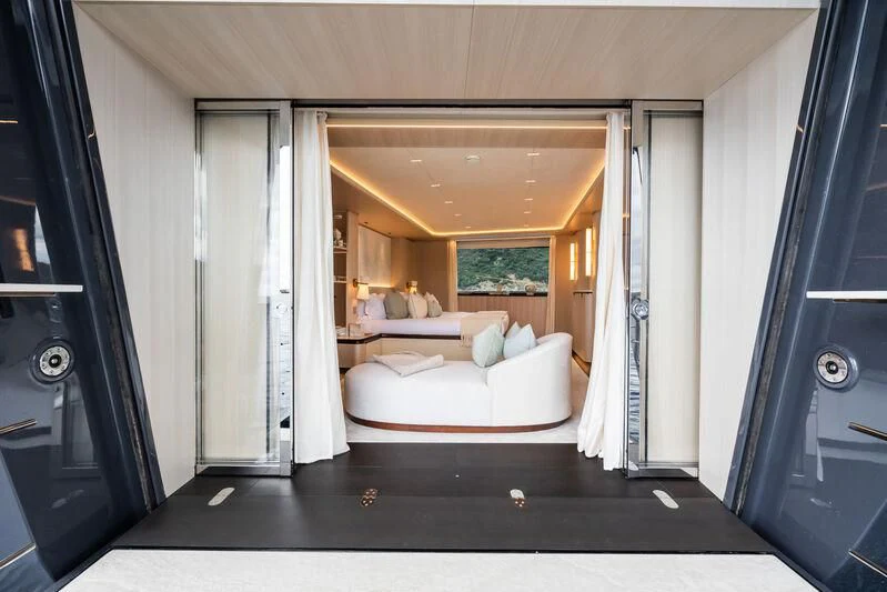 a room with a bed and a couch aboard PARA BELLVM Yacht for Charter
