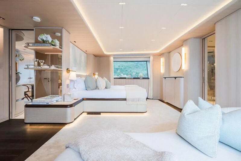 a room with a bed and a table aboard PARA BELLVM Yacht for Charter