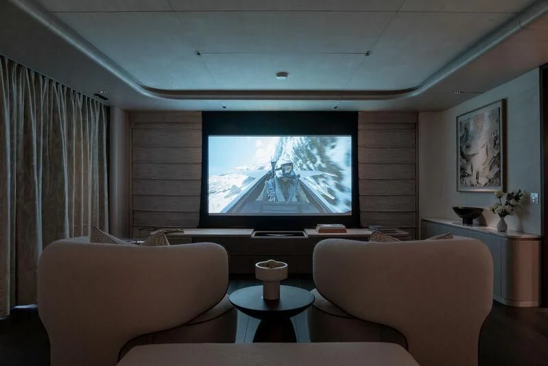 a living room with a large screen aboard PARA BELLVM Yacht for Charter