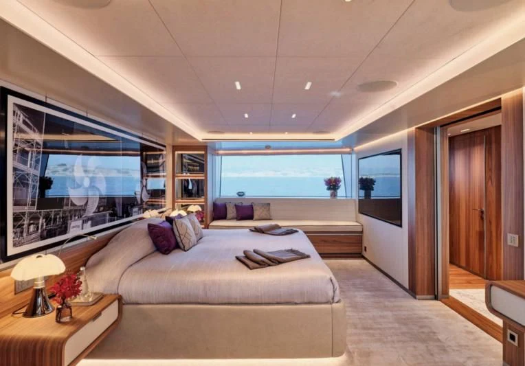 a large bedroom with a large window aboard PARA BELLVM Yacht for Charter