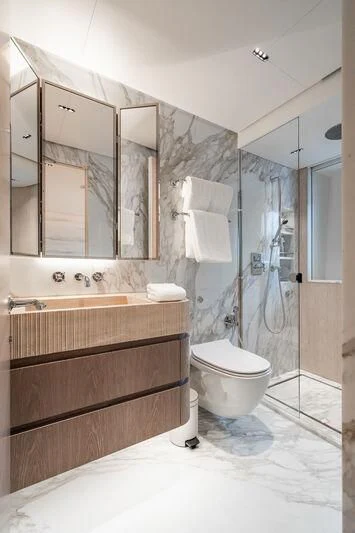 a bathroom with a glass shower aboard PARA BELLVM Yacht for Charter