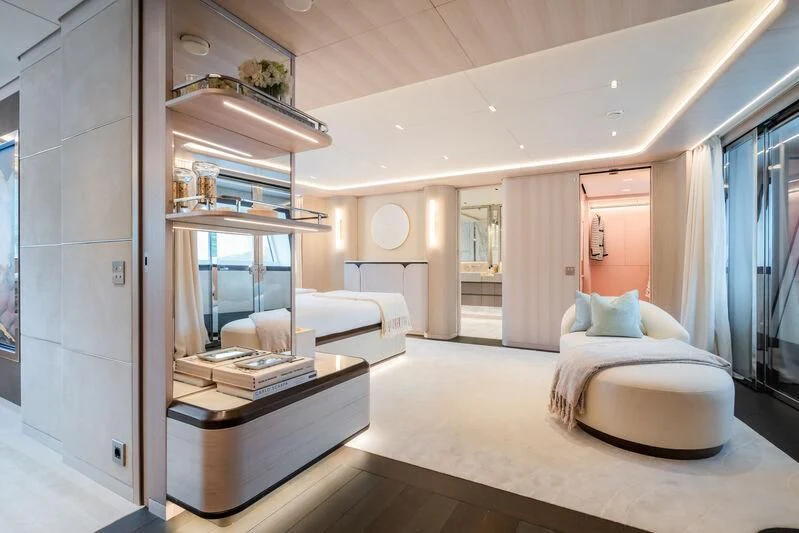 a room with a bed and a desk aboard PARA BELLVM Yacht for Charter