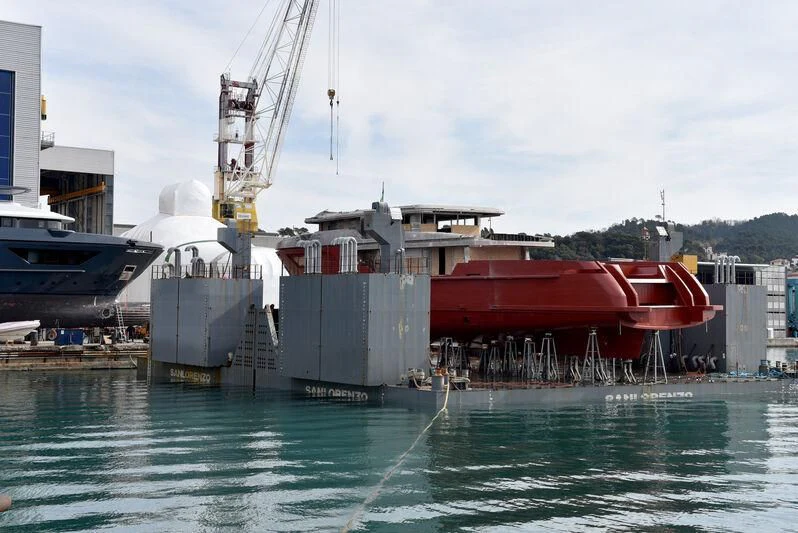 a large ship docked at a port aboard PARA BELLVM Yacht for Charter