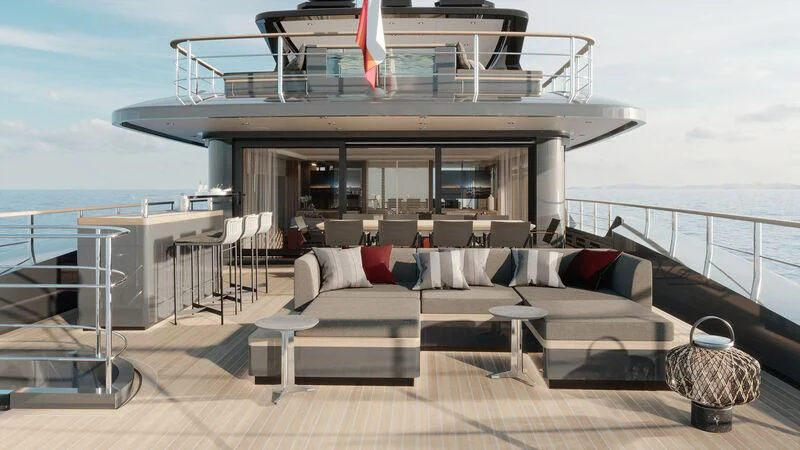 a deck with a large deck overlooking a body of water aboard PARA BELLVM Yacht for Charter