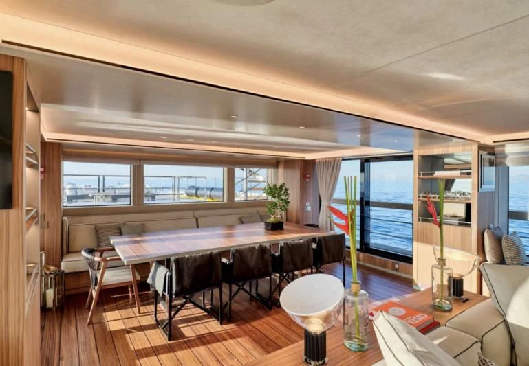 a dining room with a table and chairs aboard PARA BELLVM Yacht for Charter