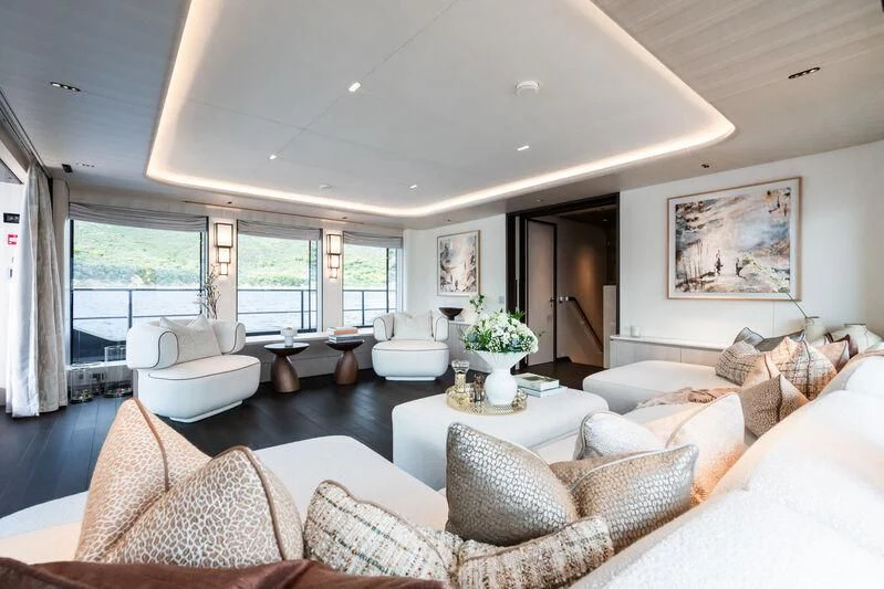 a living room with a large window aboard PARA BELLVM Yacht for Charter