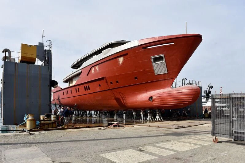 a large red boat aboard PARA BELLVM Yacht for Charter