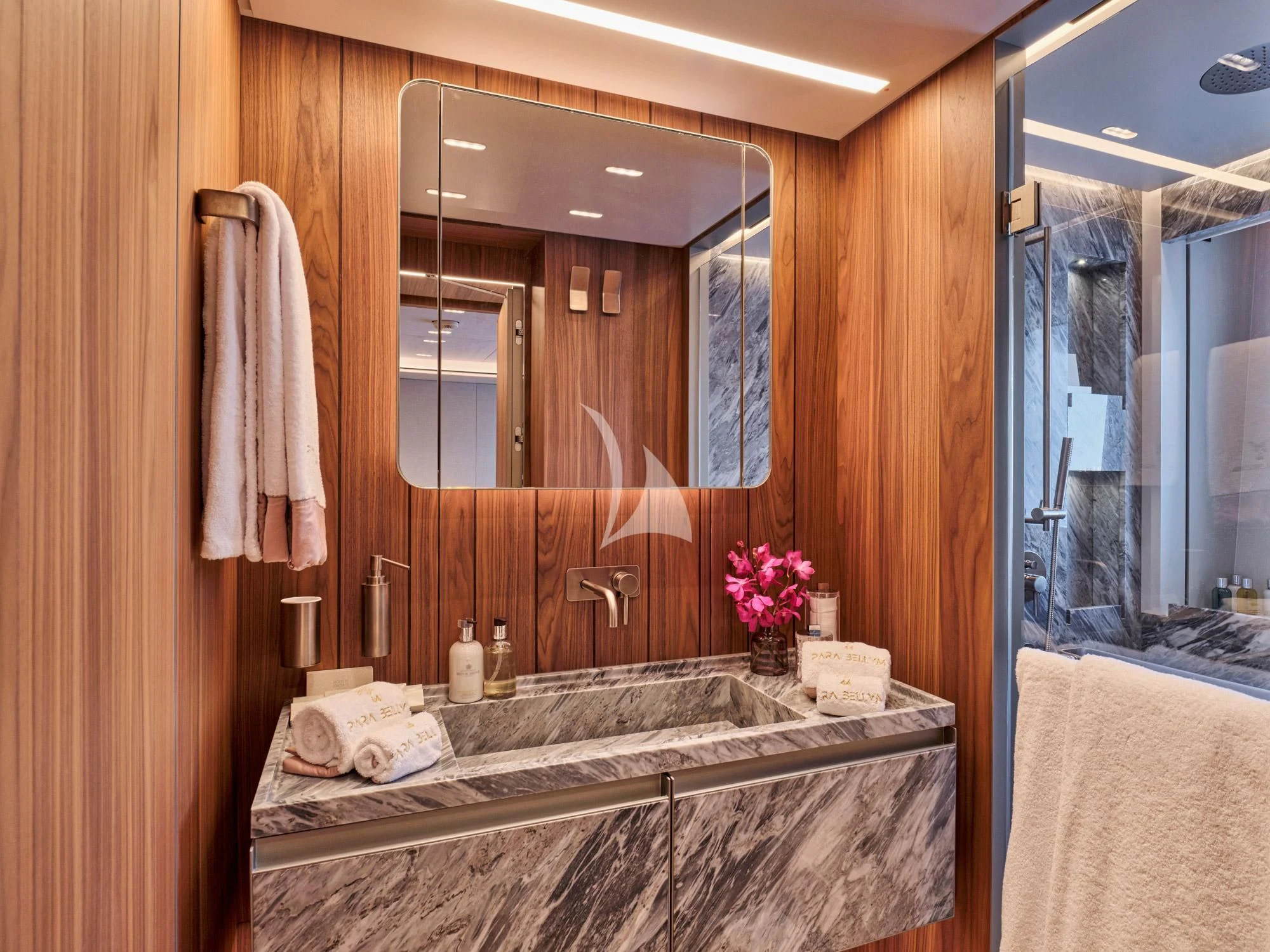 a bathroom with a large mirror aboard PARA BELLVM Yacht for Charter
