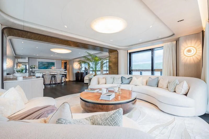 a living room with a large window aboard PARA BELLVM Yacht for Charter