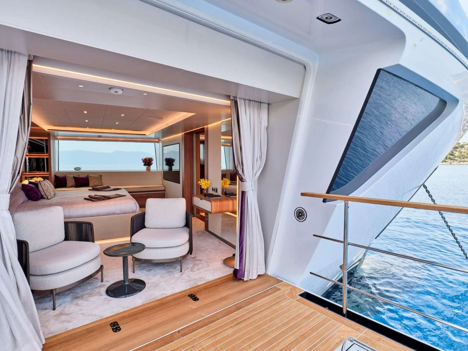 a living room with a large window aboard PARA BELLVM Yacht for Charter